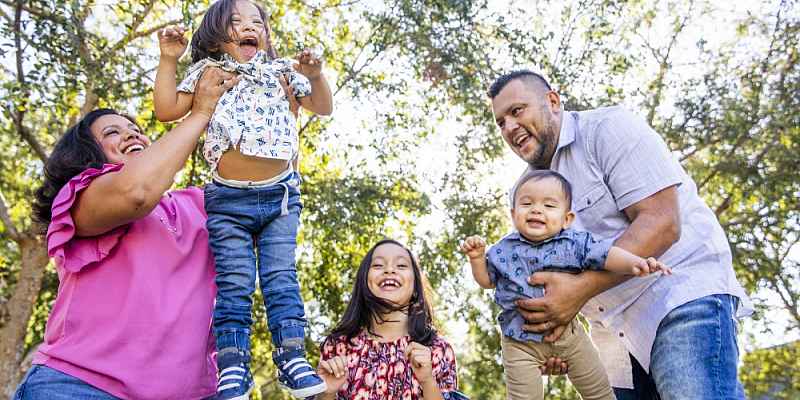 Family plays in the park.