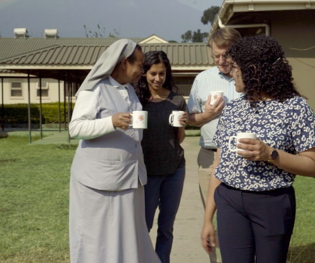 Nun walking with group outdoors