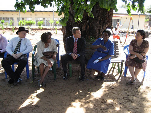 Carmen sitting with the Deputy chief of the mission